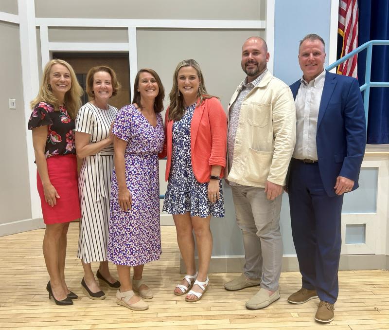 District Teacher of the Year Dr. Krissy Patton is congratulated by district and Milton Elementary administrators. Gathered are (l-r) Assistant Superintendent Jenny Nauman, school board President Alison Myers, Principal Clara Conn, Patton, Assistant Principal Jason Scott and Superintendent Bob Fulton.